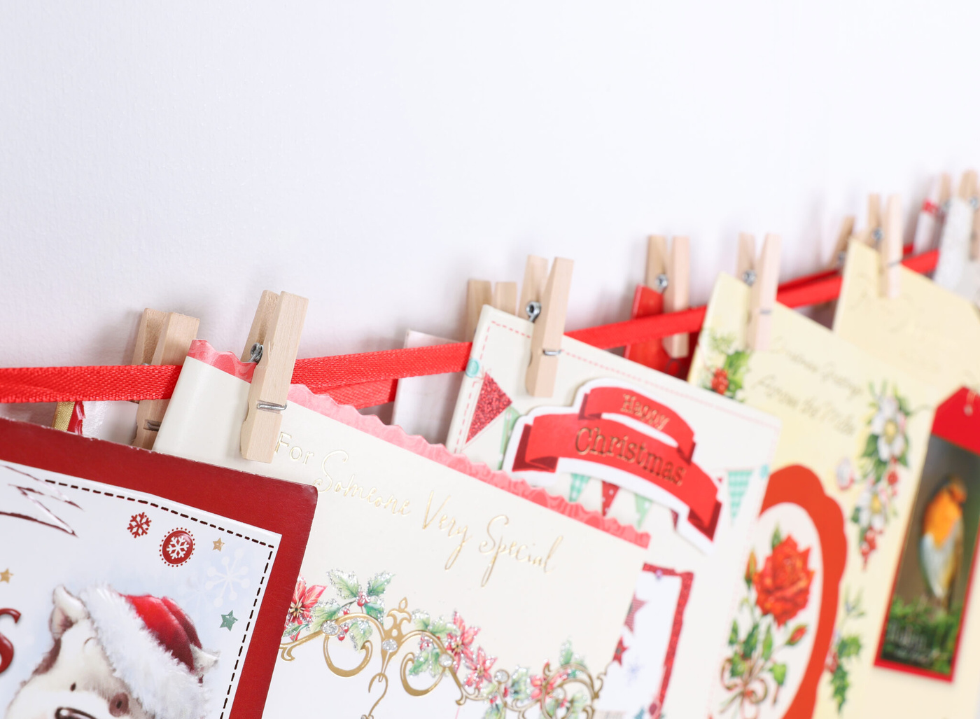 Christmas card holder decoration, multi-colour, set of 12 — we r christmas Christmas Concepts® Santa Sleigh & 4 Reindeers Fabric Christmas Card Holder With Wooden Pegs