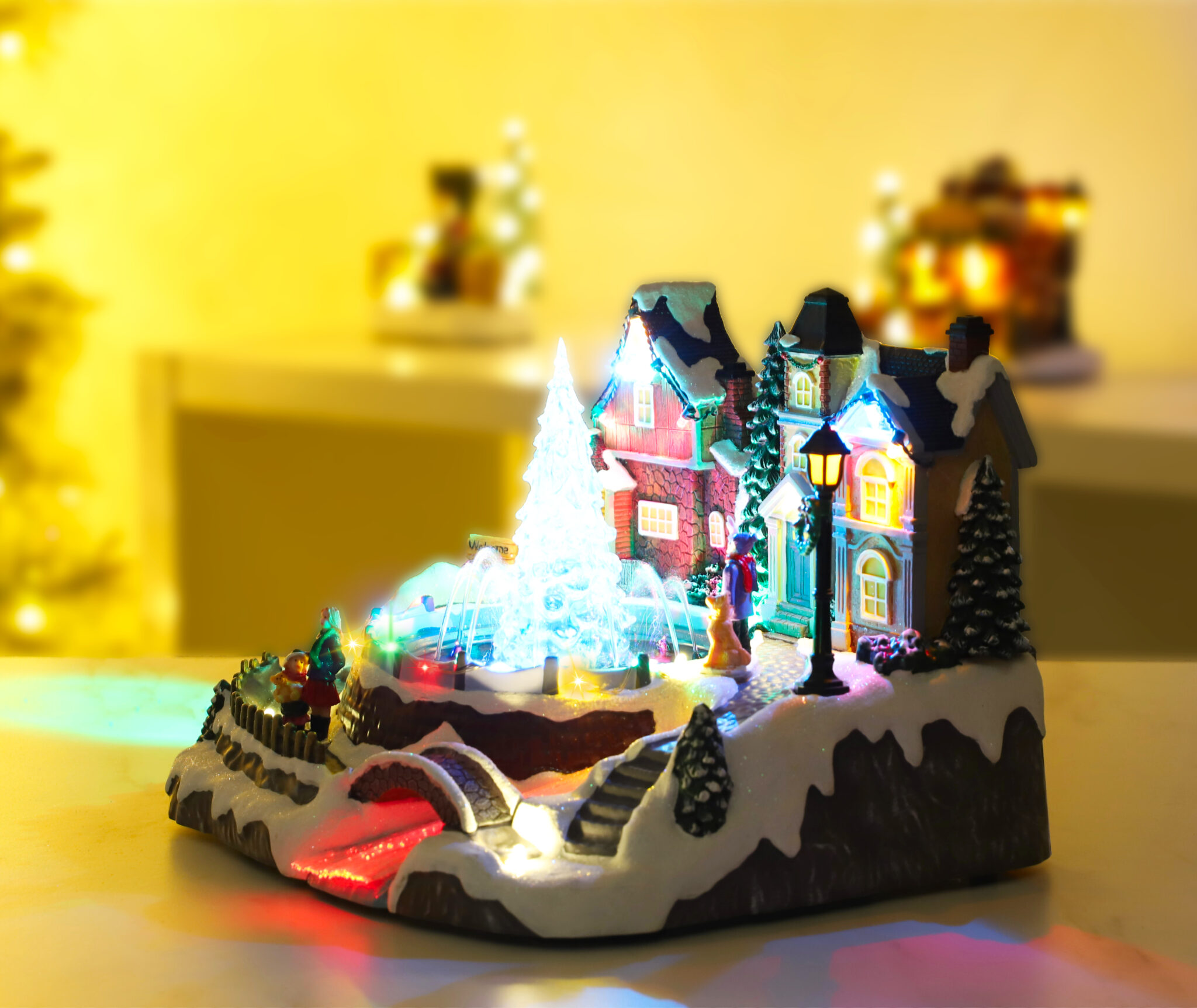 Christmas Concepts® 27cm LED Light Up Village Scene with Real Water Fountain and Music – Battery 